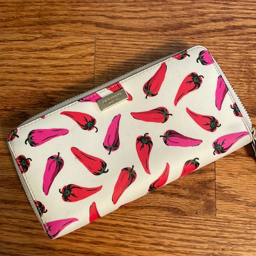 Classic Kate Spade wallet with whimsical pepper design